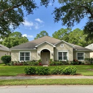 A beautiful Florida home surrounded by greenery, symbolizing the concept of homestead protection for new residents